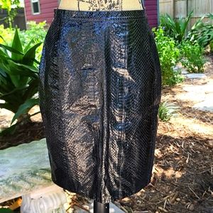 Vintage black snakeskin large pencil skirt. Gently worn condition. Lined